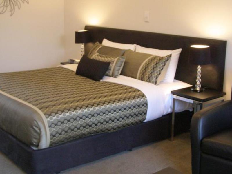 Bellano Motel Suites Christchurch Esterno foto A bed